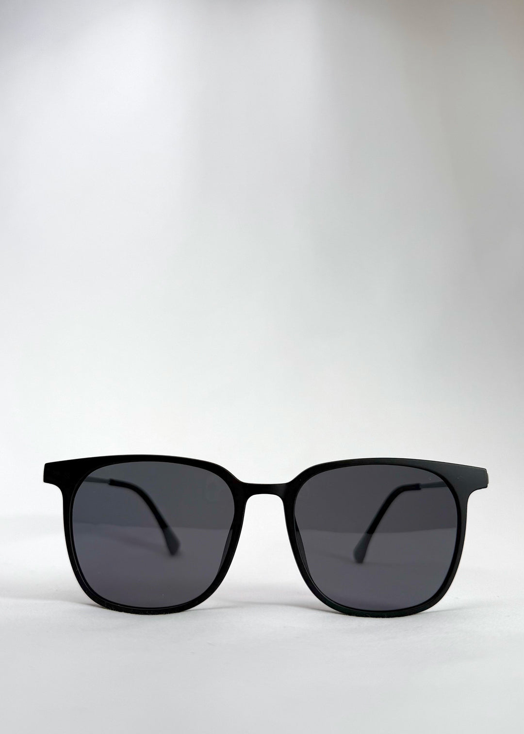 Front view of Achernar classic black titanium sunglasses with UV400 polarized lenses for superior eye protection.