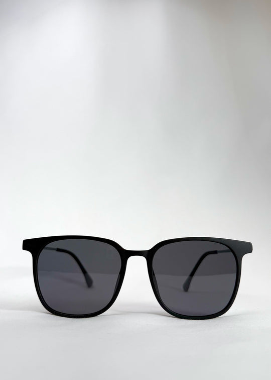 Front view of Achernar classic black titanium sunglasses with UV400 polarized lenses for superior eye protection.