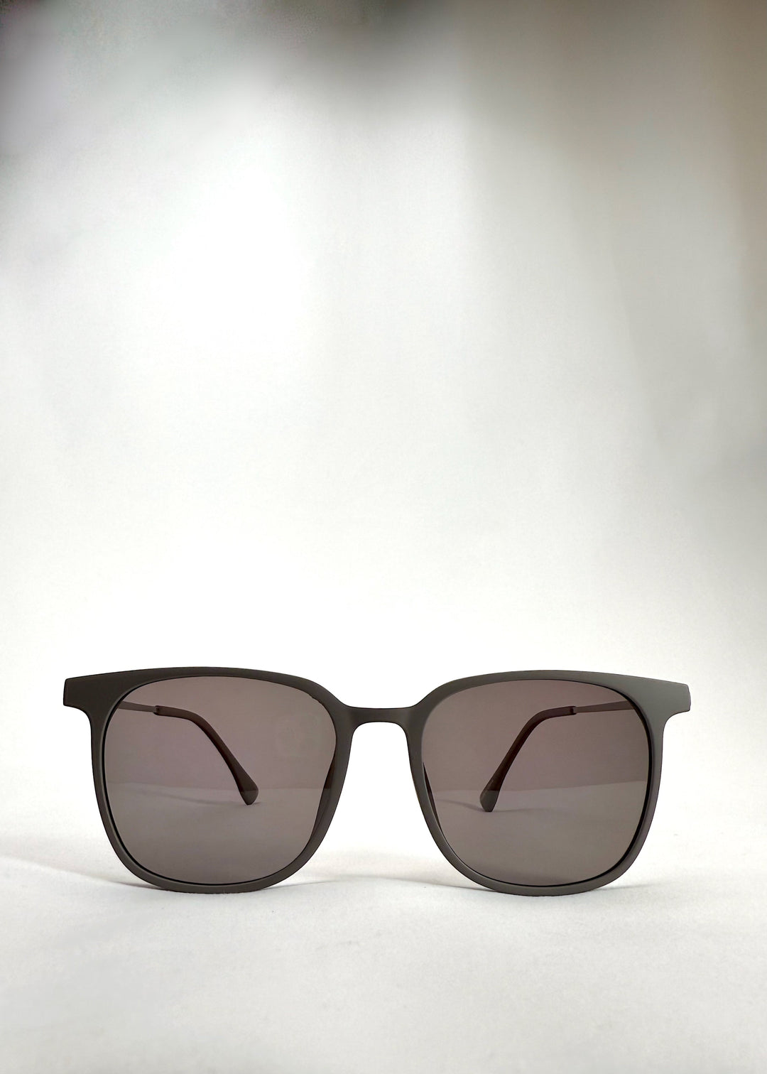 Front view of Achernar khaki brown titanium sunglasses with UV400 polarized lenses for premium eye protection.