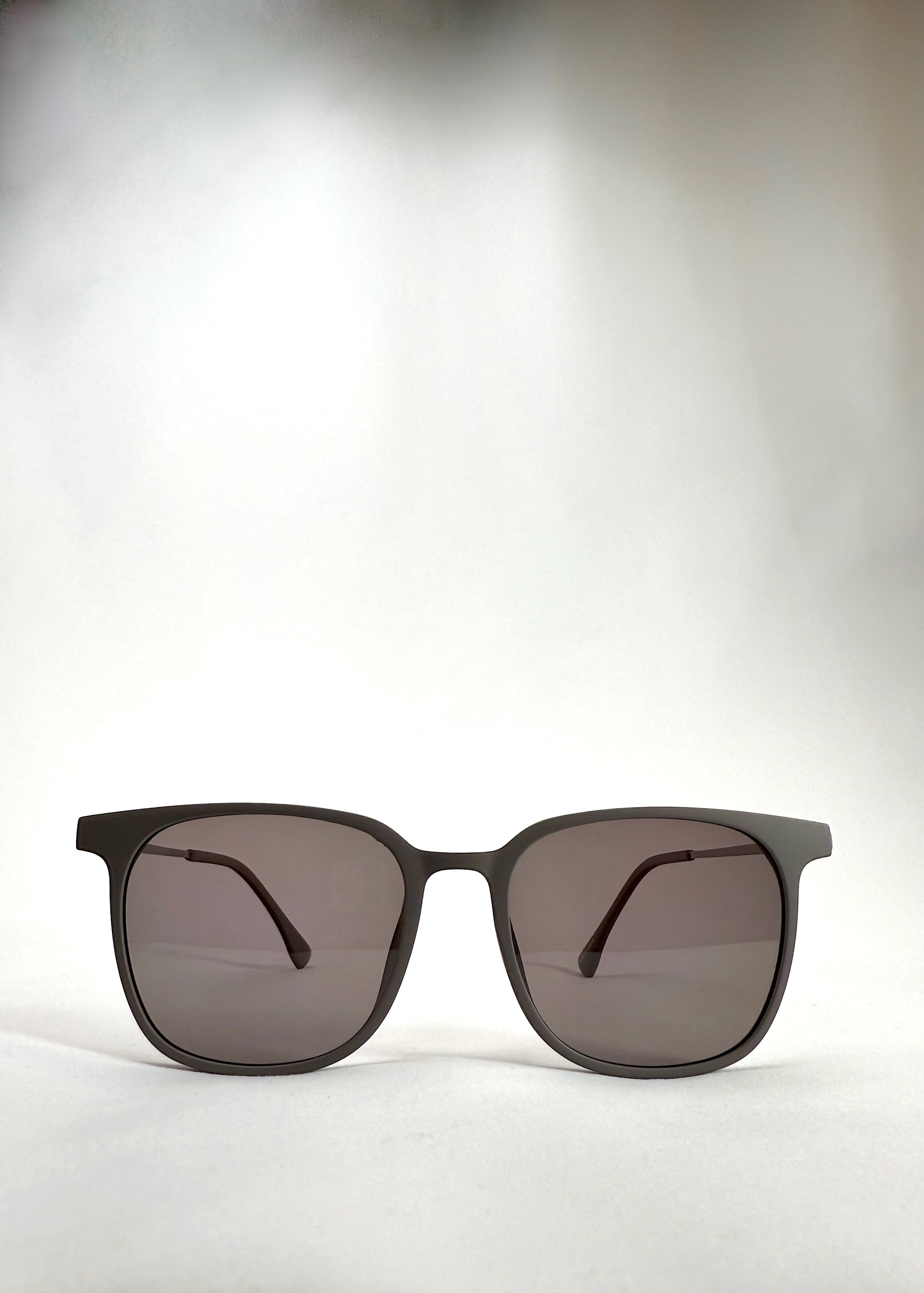 Front view of Achernar khaki brown titanium sunglasses with UV400 polarized lenses for premium eye protection.