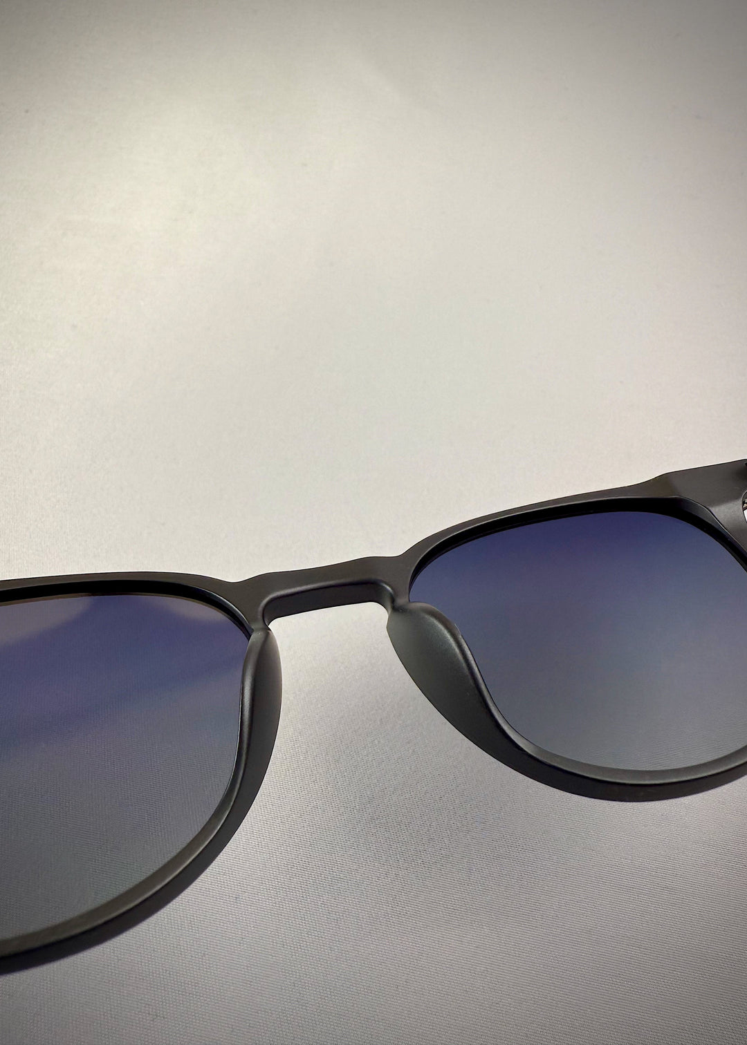 Close-up view of Altair Matte Gray Titanium prescription sunglasses – Lightweight 12g frame with UV400 polarized lenses for glare reduction and optical clarity.