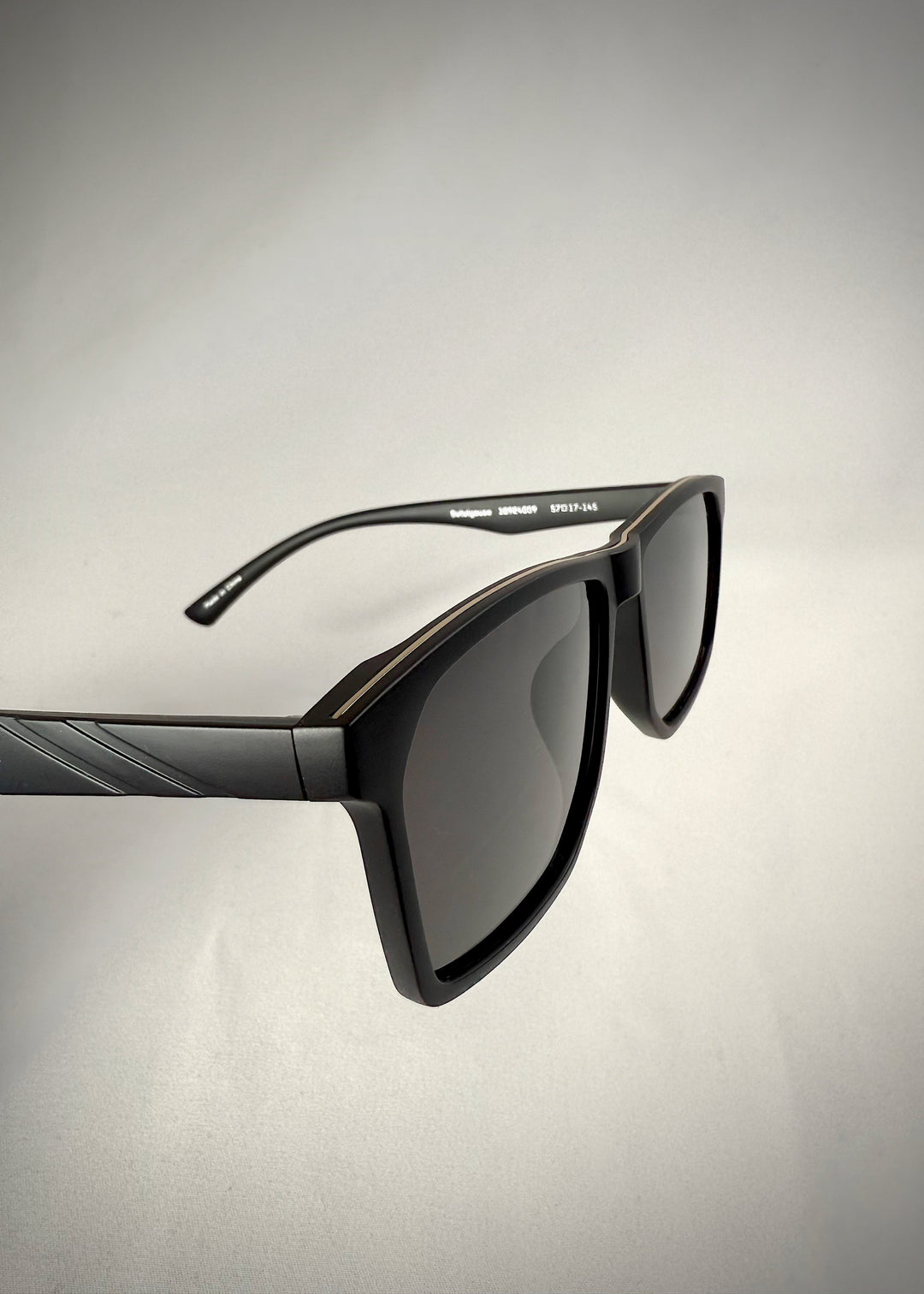 Side angle of Betelgeuse matte black TR90 sunglasses – Sleek lines and bold aesthetics.