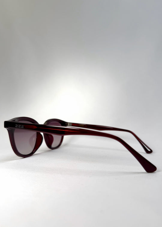 Side view of Elvor sunglasses in Mulberry Mist, highlighting the deep wine-red temples and smooth acetate arms.