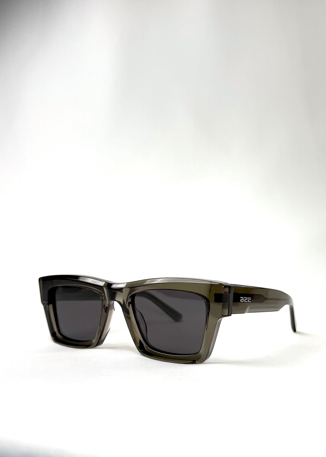 Angled close-up of Fomalhaut gray-green acetate sunglasses, highlighting modern design
