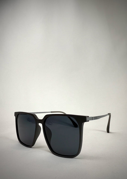 Angled view of Gemini Matte Gray sunglasses, highlighting the sharp contours and lightweight titanium frame.