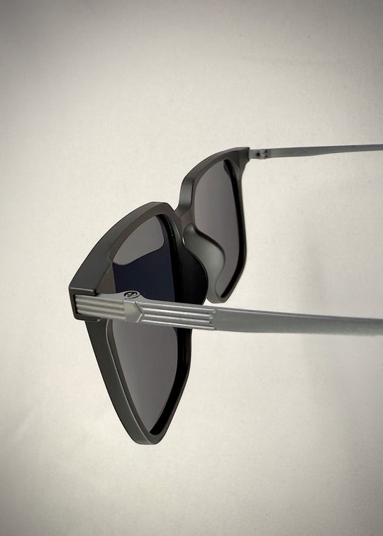 Close-up of Gemini Matte Gray titanium sunglasses’ temple, displaying the premium material and minimalist design.