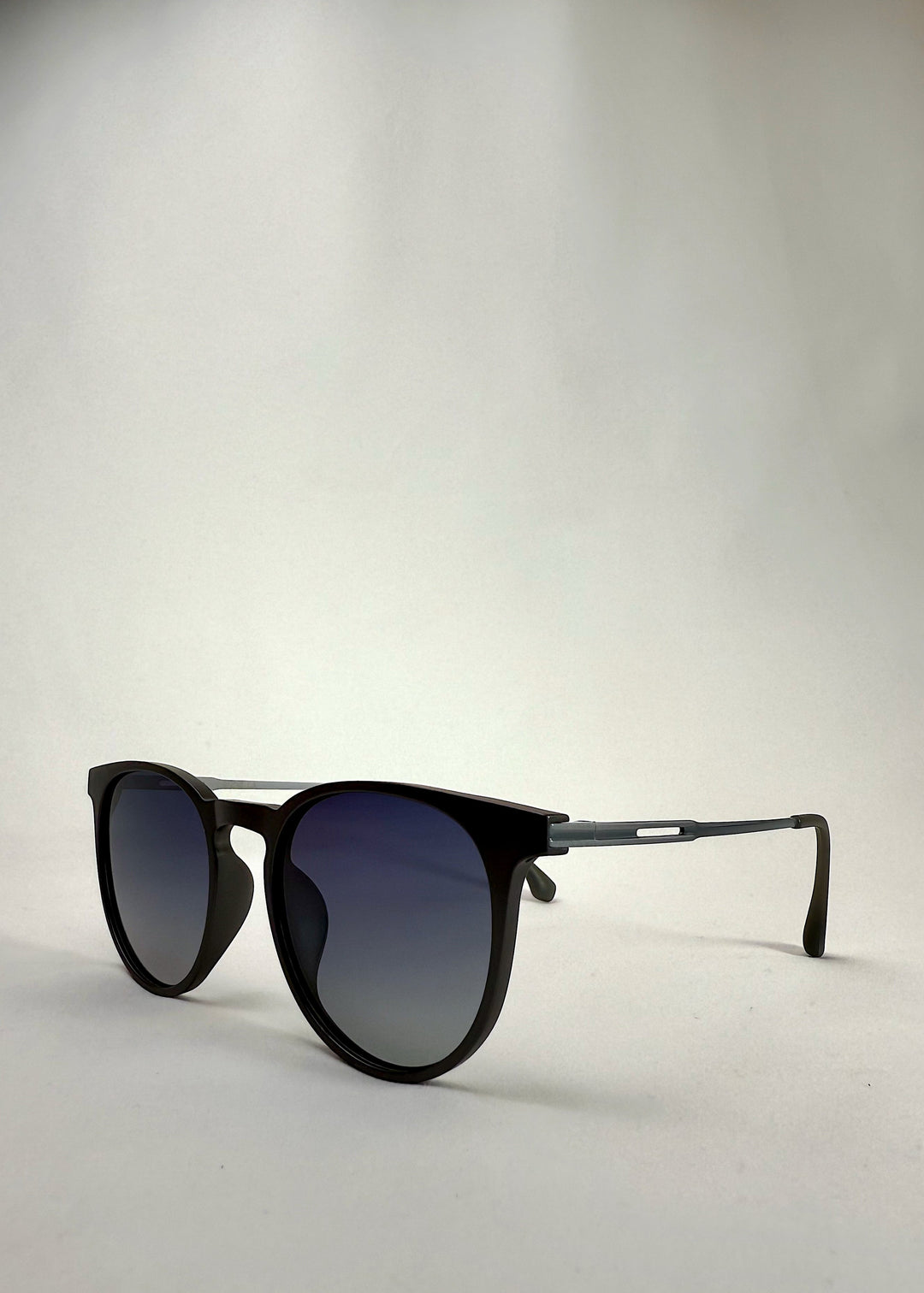 Angled view of Altair Matte Gray Titanium sunglasses - Lightweight and durable for all-day comfort.