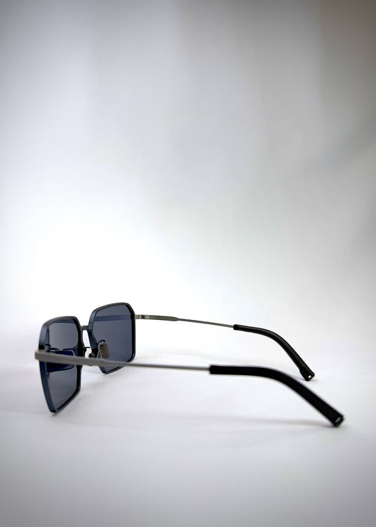 Side view of Rigel matte blue titanium sunglasses showcasing the lightweight titanium frame and sleek matte finish.