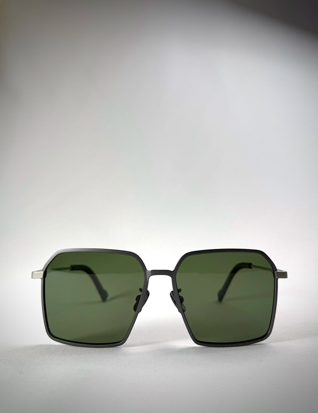 Front view of Rigel matte gray titanium sunglasses, featuring a bold geometric design and high-quality polarized lenses.