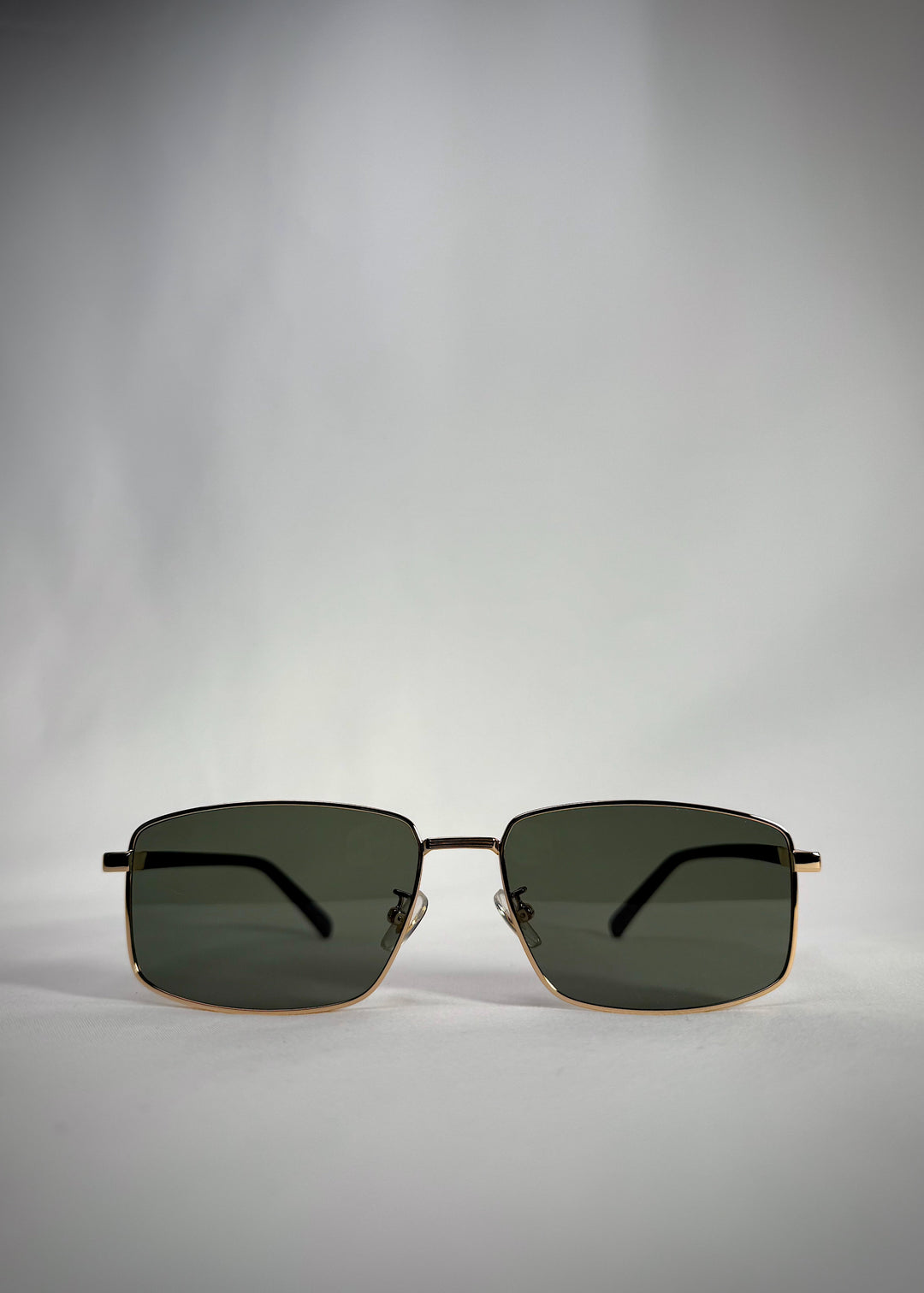 Front view of Sirius A - Gold stainless steel sunglasses with polarized green lenses – a perfect blend of classic luxury and modern precision.