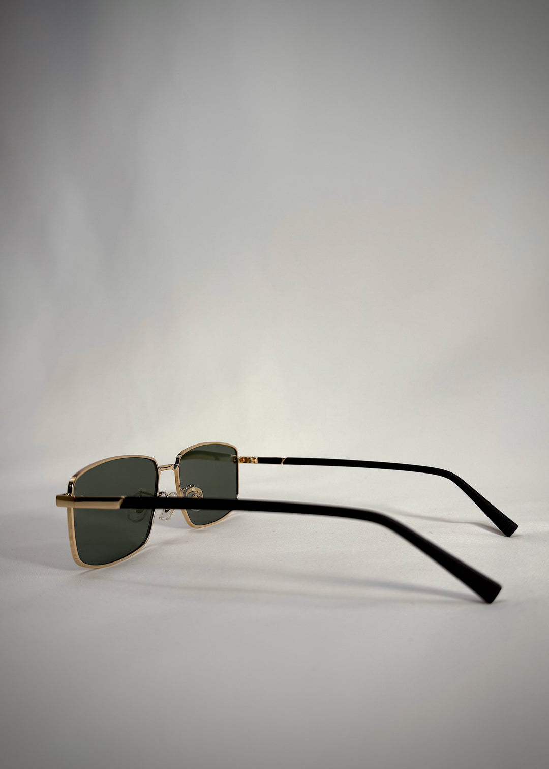 Side view of Sirius A - Gold sunglasses, showcasing the gold stainless steel frame and sleek temple design.