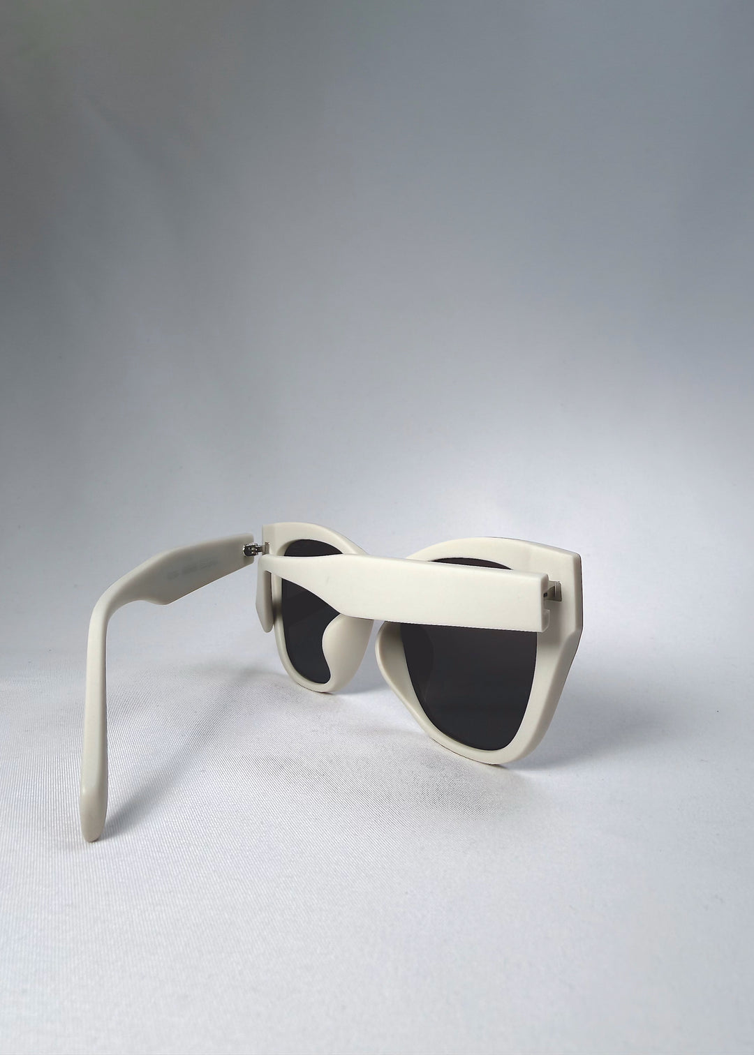 Folded view of Veyron Pale Mirage sunglasses emphasizing temple design and hinge craftsmanship.