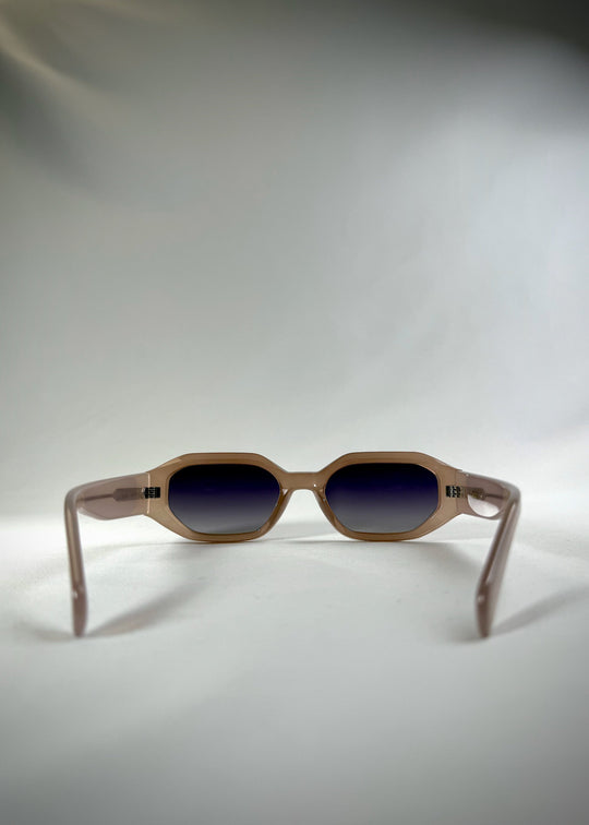 Castor Champagne sunglasses – back view showcasing geometric acetate frame with gradient blue lenses. 
