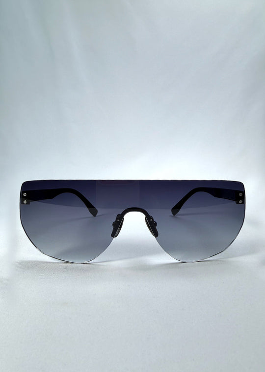 Front view of Aegis Field sunglasses in Gunmetal Veil, featuring one-piece titanium shield frame and gunmetal-to-grey gradient lens, showing the full front silhouette. 