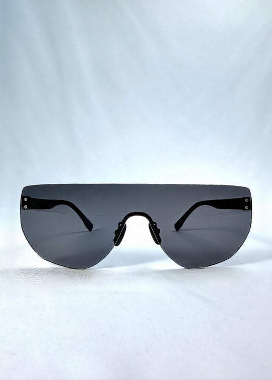 Front view of Aegis Field sunglasses in Mercury Shadow, featuring one-piece titanium shield frame and silver mirrored lens, showing the full front silhouette. 