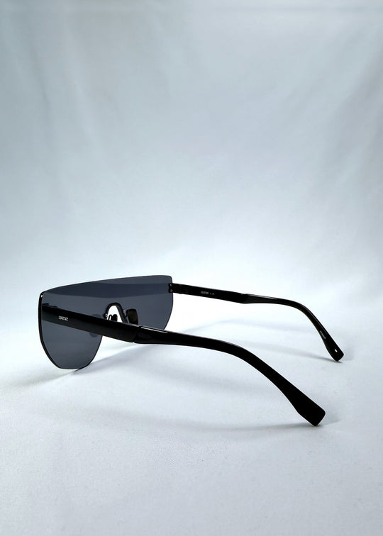 Side view of Aegis Field sunglasses in Mercury Shadow, featuring one-piece titanium shield frame and silver mirrored lens, showing the lens shape and temple profile.