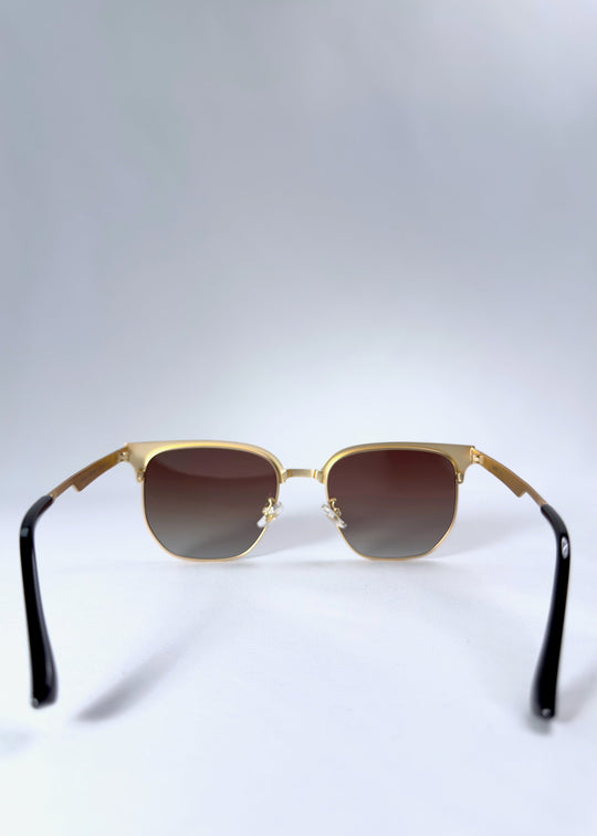 Back view of Altessa sunglasses highlighting the adjustable nose pads and golden metal frame structure. 