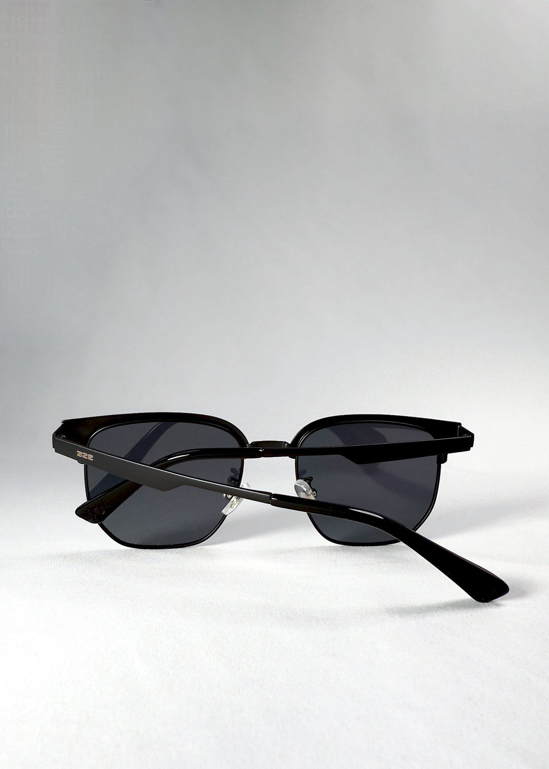 Back view of Altessa sunglasses in Eclipse Black, with a clear look at the adjustable nose pads and semi-rimless lens structure. 