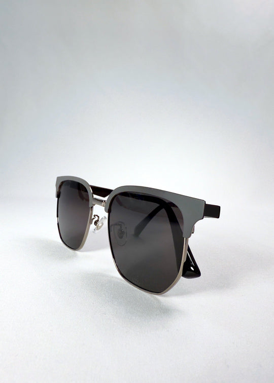 Folded view of Altessa Gunmetal Ash sunglasses emphasizing slim arms and dual-tone frame contrast. 
