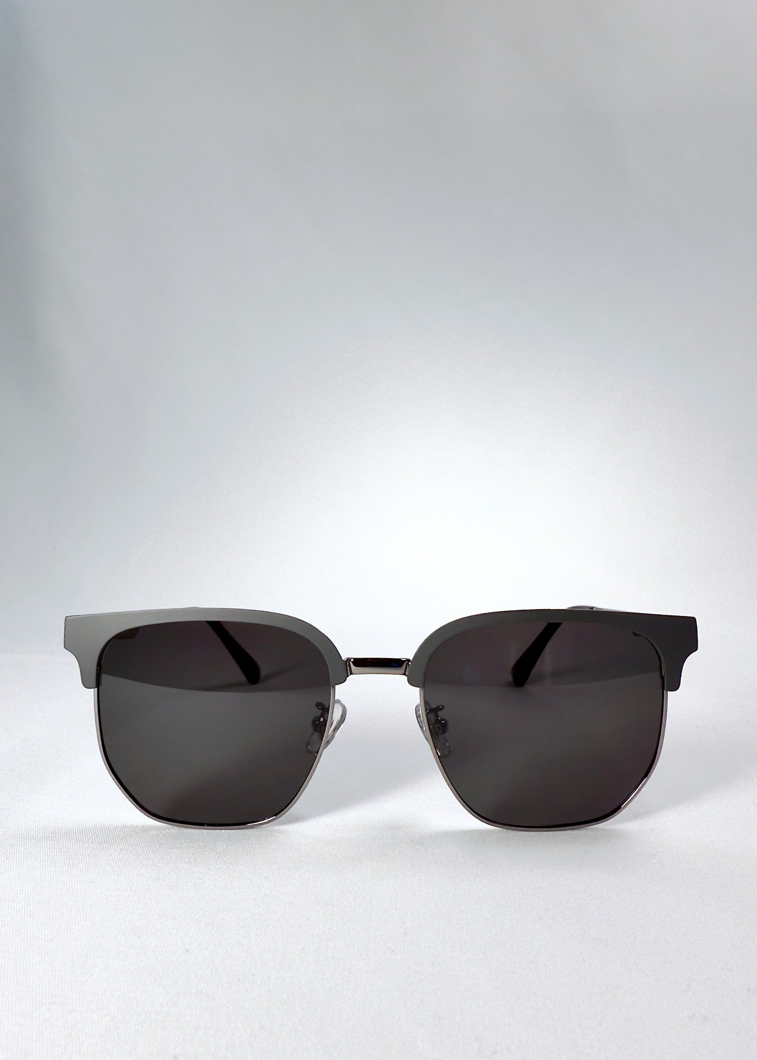 Front view of Altessa sunglasses in Gunmetal Ash, featuring a semi-rimless browline design and dark grey polarized lenses.