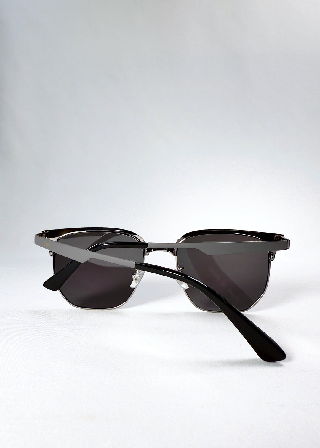 Inside view of Altessa sunglasses in Gunmetal Ash, revealing nose pad structure and inner temple details. 