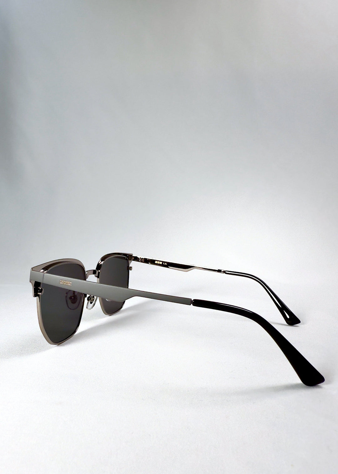 Side view of Altessa Gunmetal Ash showing the brushed grey stainless steel temples and AZE logo detailing. 