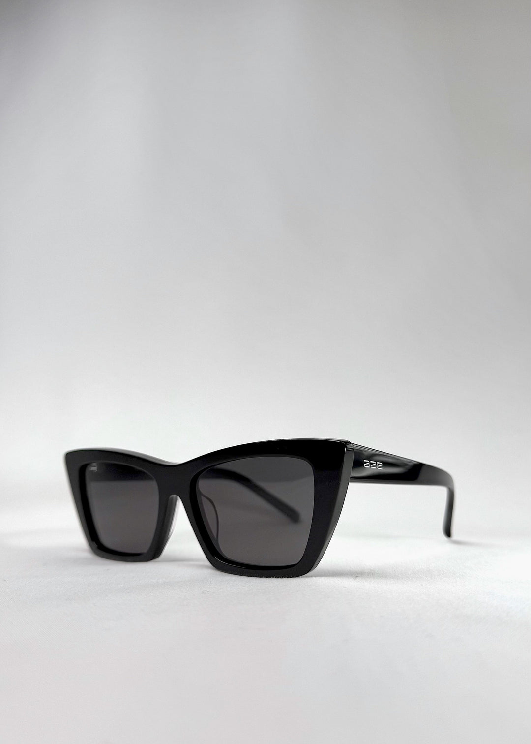 Angled close-up of Aquila Black sunglasses, emphasizing the frame&