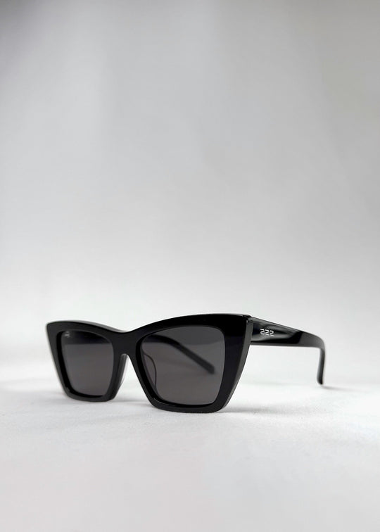 Angled close-up of Aquila Black sunglasses, emphasizing the frame&