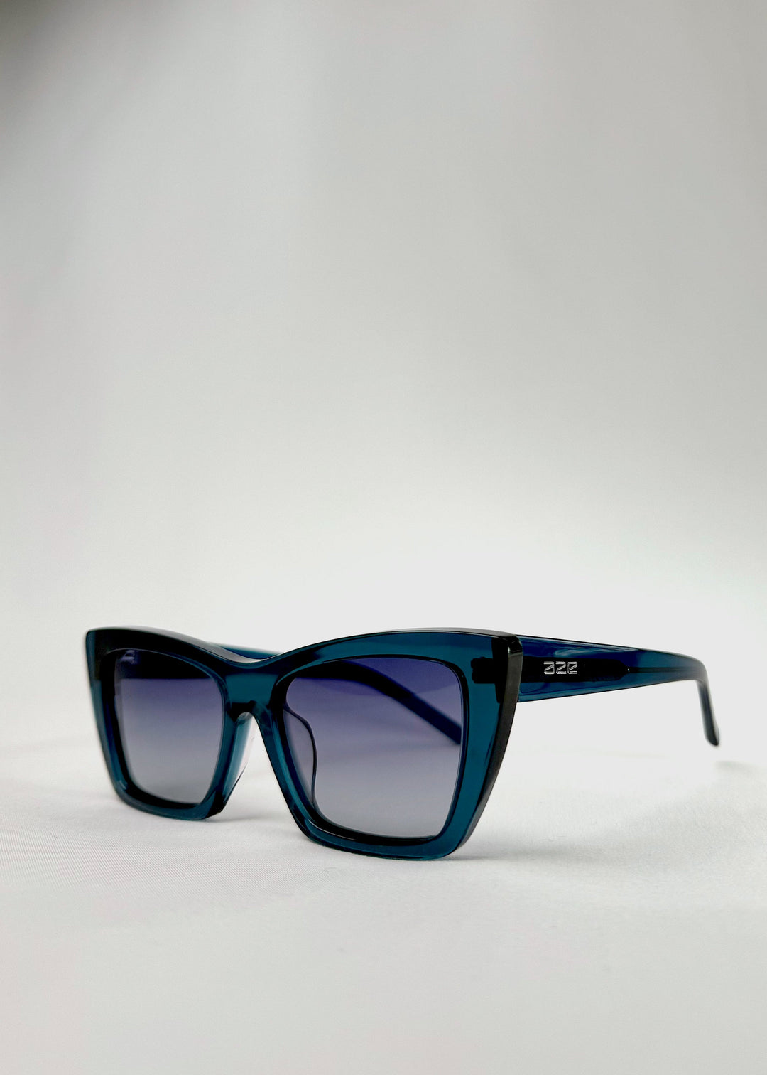 Angled close-up of Aquila Blue acetate sunglasses, highlighting the frame&