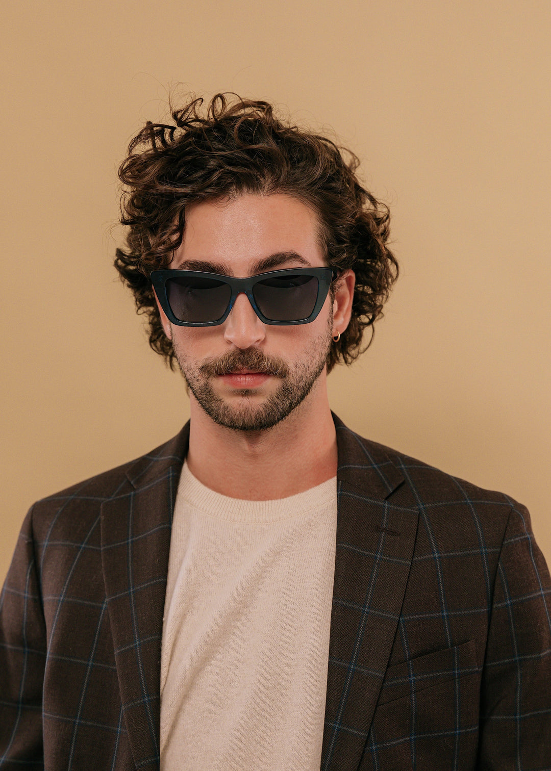 Male model wearing Aquila Blue acetate sunglasses, styled for a confident modern look. 