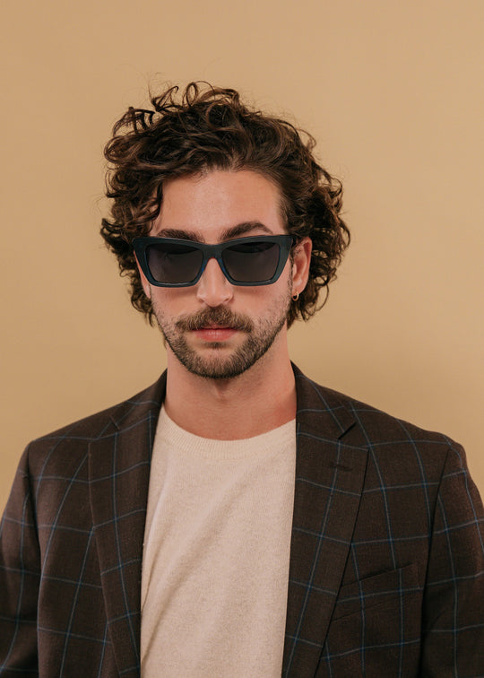 Male model wearing Aquila Blue acetate sunglasses, styled for a confident modern look. 