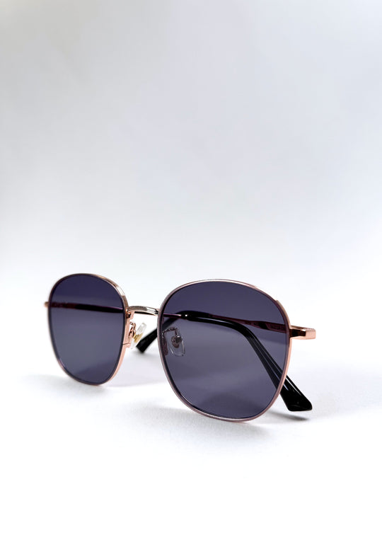 Astris Midnight Blue sunglasses – folded view revealing portability and temple contrast. 