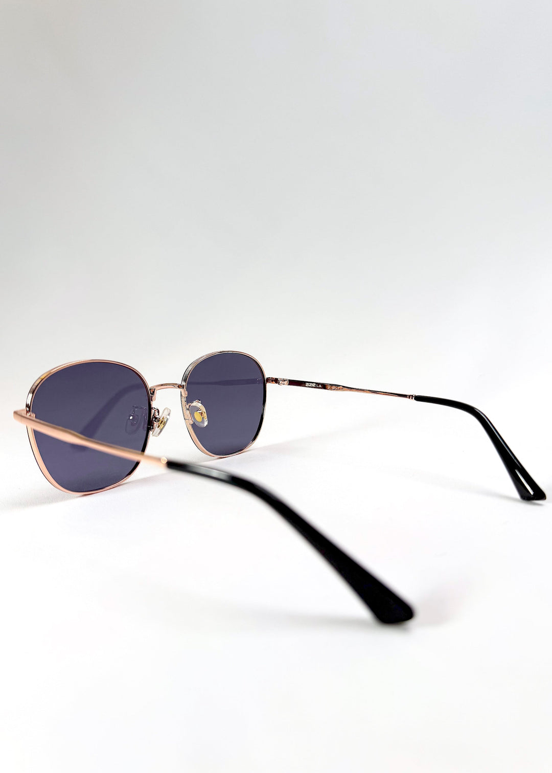 Astris Midnight Blue sunglasses – side profile showcasing the sleek stainless steel temples. 