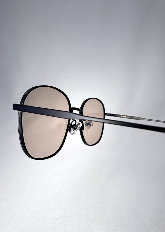 Side view of Astris sunglasses in Satin Bronze with stainless steel frame and HD nylon lenses. 