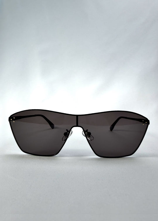 Front view of Atlas Shield sunglasses in Slate Smoke, featuring one-piece shield lens, slim metal frame, and full grey tint, showing the full front silhouette.