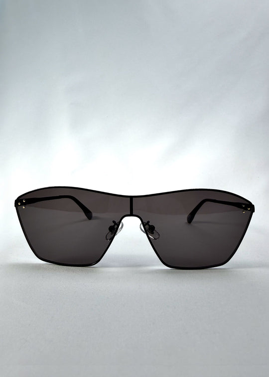 Front view of Atlas Shield sunglasses in Slate Smoke, featuring one-piece shield lens, slim metal frame, and full grey tint, showing the full front silhouette. 
