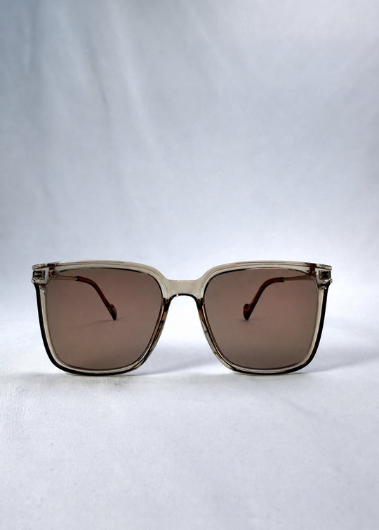 Front view of Auralis sunglasses in Mocha Bronze, featuring mocha bronze frame and warm brown lenses, showing the full front silhouette.