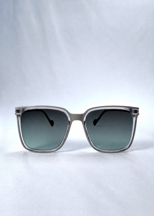 Front view of Auralis sunglasses in Rose Graphite, featuring rose graphite frame and green gradient lenses, showing the full front silhouette.