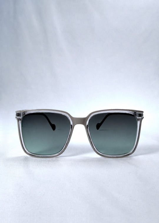 Front view of Auralis sunglasses in Rose Graphite, featuring rose graphite frame and green gradient lenses, showing the full front silhouette. 