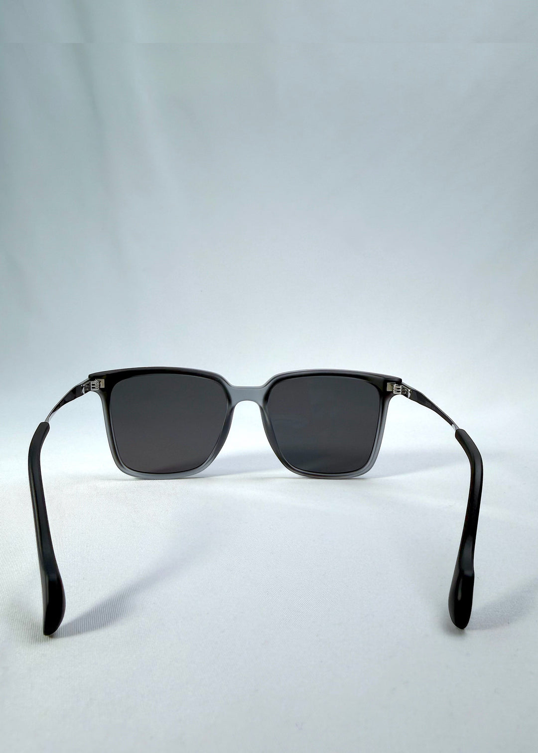 Back view of Auralis sunglasses in Sand Haze showing the fixed nose bridge and open temples. 