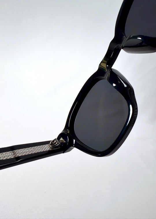 Close-up of Auren Black’s inner hinge and temple texture with visible construction details. 