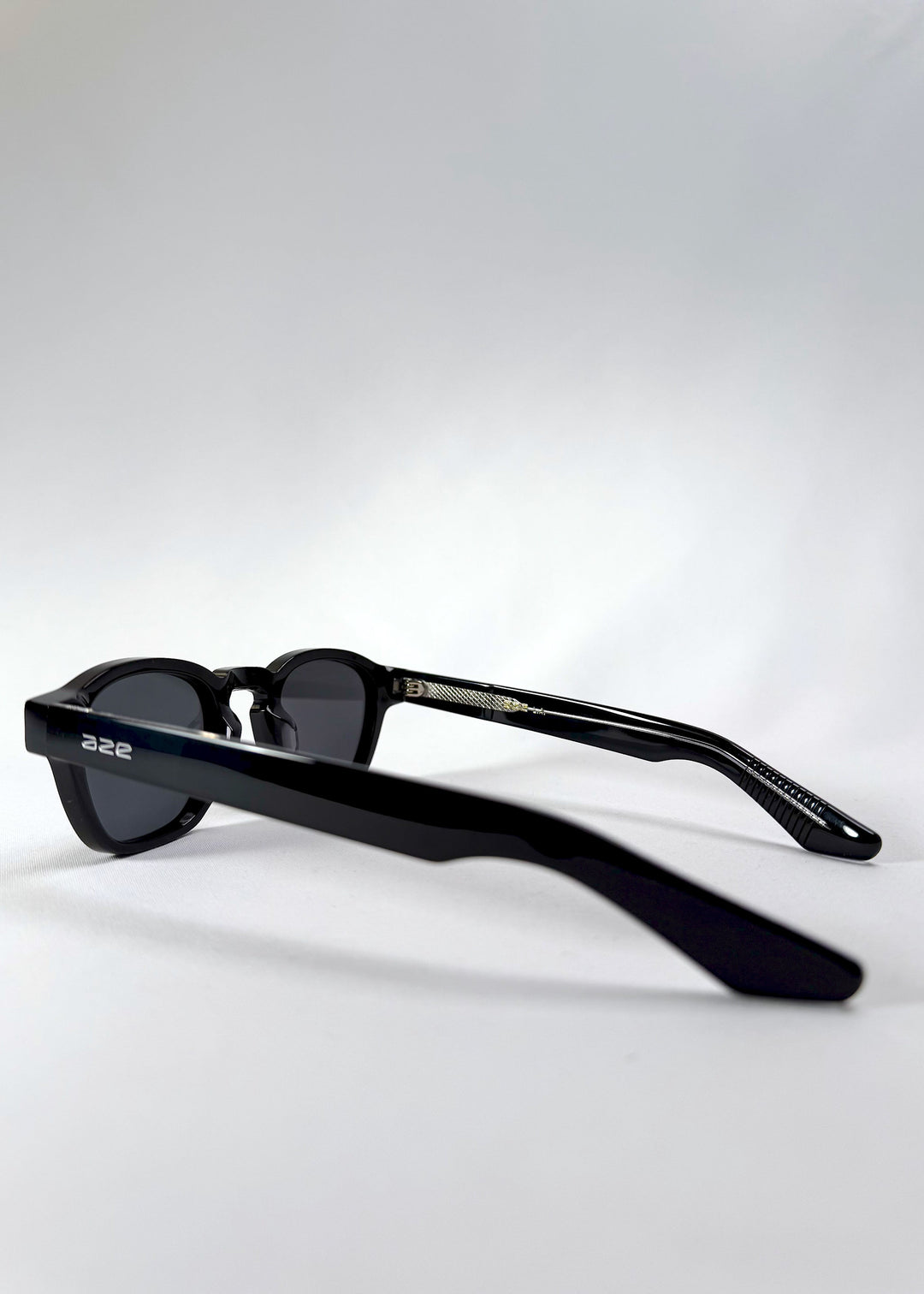 Side view of Auren Black sunglasses showing the clean temple line and discreet Aze logo. 