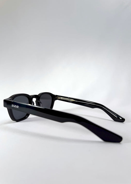 Side view of Auren Black sunglasses showing the clean temple line and discreet Aze logo. 