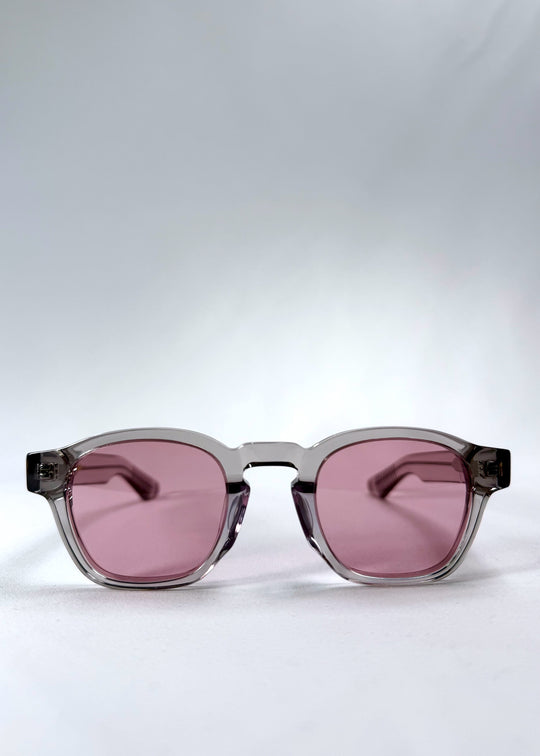 Front view of Auren in Blush Grey showing soft blush-tinted lenses and crystal-clear round acetate frame.