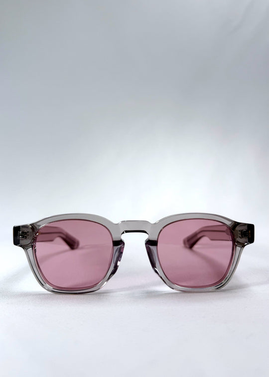 Front view of Auren in Blush Grey showing soft blush-tinted lenses and crystal-clear round acetate frame. 