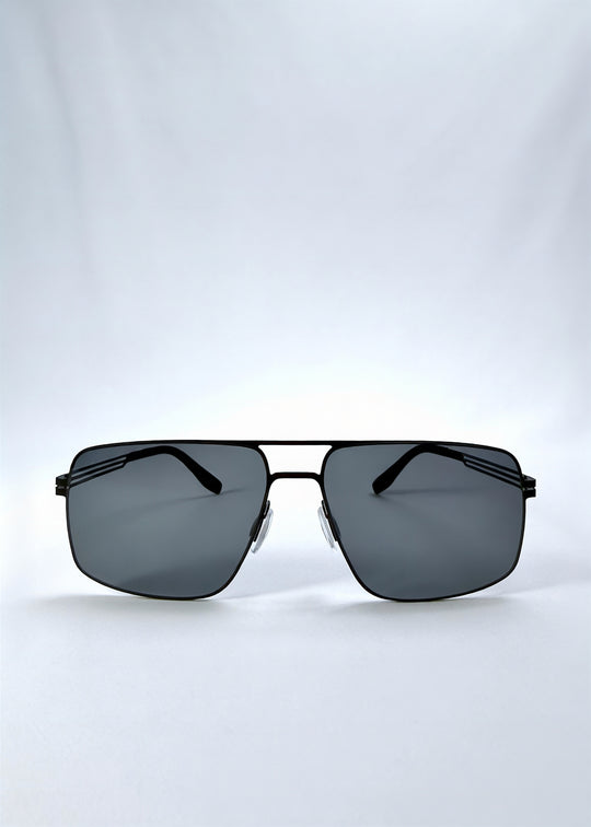 Front view of Axiom sunglasses in Matte Black, featuring matte black rectangular metal frame and grey polarized lenses, showing the full front silhouette.