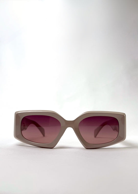 Front view of Bellatrix warm taupe acetate sunglasses featuring an oversized frame and UV400 polarized lenses. 