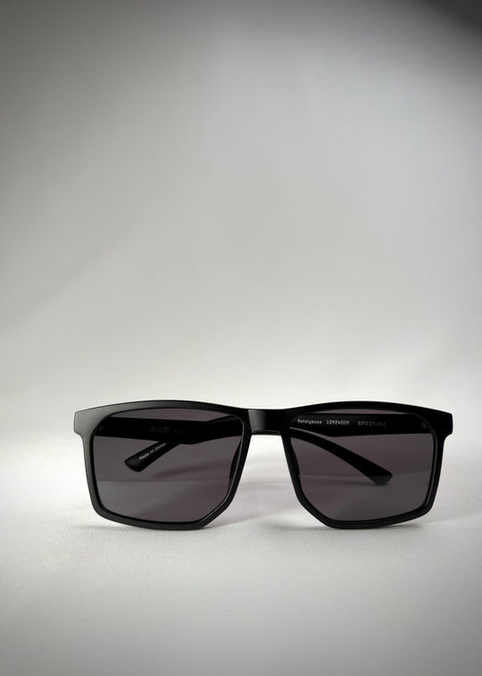 Folded Betelgeuse matte black sunglasses – Compact, lightweight, and designed for easy storage. 