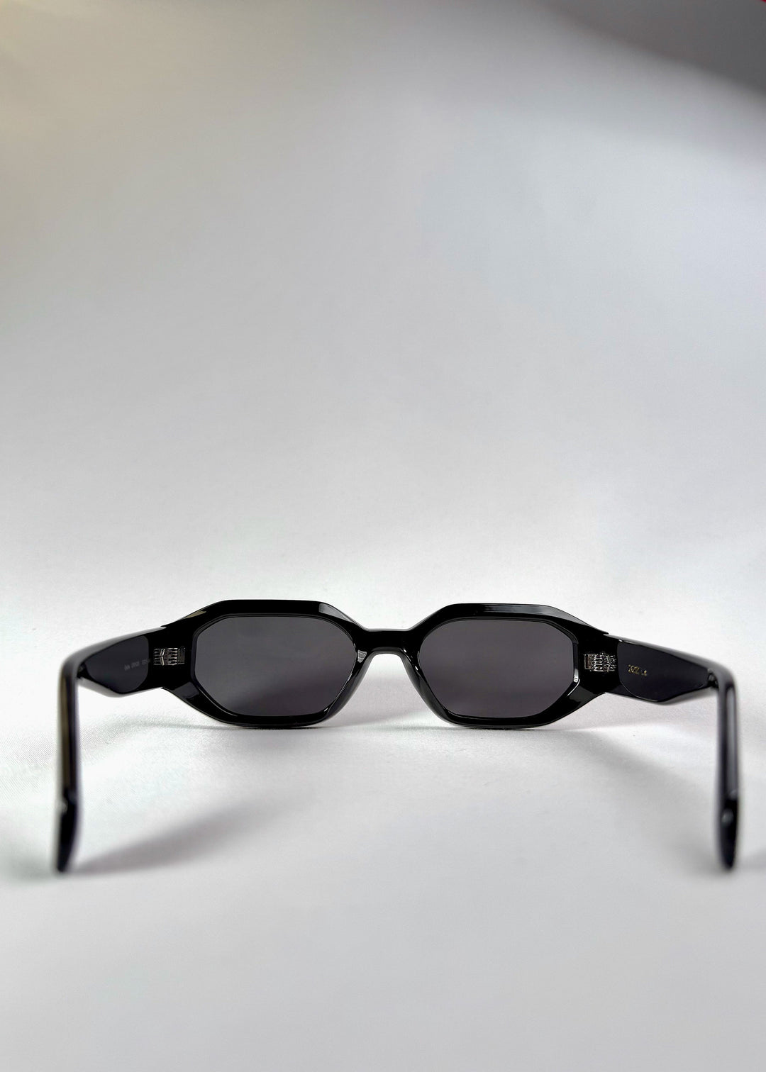 Back view of Castor - Black acetate prescription sunglasses, displaying the frame’s curvature and balanced proportions. 