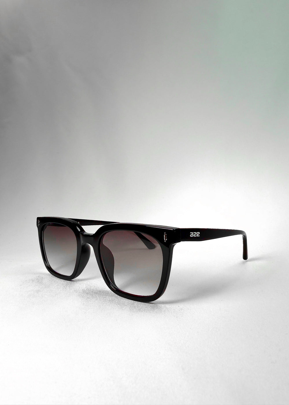 Angled front view of Cavalin Graphite Haze showing bold brow line and softened base for balanced look. #color_graphite-haze